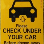 check under car sign