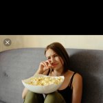 Woman Eating popcorn and crying.