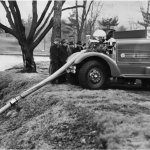 antique fire truck siphoning water