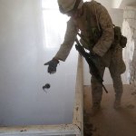 soldier tossing grenade down stairwell