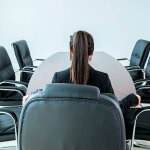 Woman in empty board room CEO template