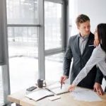 woman man talk office table