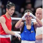 Female Boxer Signs With an X