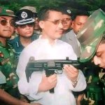 Babar_holding_uzi