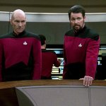Riker and Picard at rear bridge console.