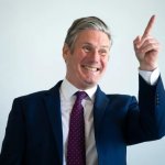 Starmer laughs and points