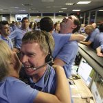 Nasa employees hugging