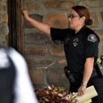 Police officer knocking at door