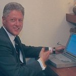 Bill Clinton points at computer