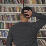 Confused man in library