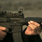 Man Aiming a Colt M16A3 with an Interesting sght