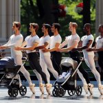 male ballet dancers pushing baby strollers