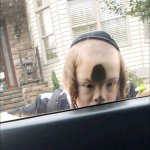 Jewish kid lurking into car.