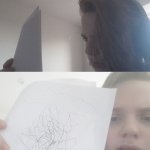 Guy looks at a paper filled with scribbles