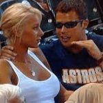 Annoying excited man tries to impress blonde girl at sports game