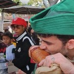 Eating turkey leg while 3 people watch