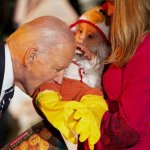 Biden biting baby