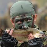 Soldier eating fish
