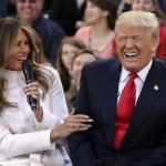 Trump laughubg with Melania