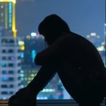 depressed girl sitting window