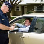 Officer writing ticket