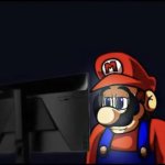 promo mario looking at the computer sad