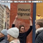 Man Holding Cardboard Sign | GUESS WHAT THIS PLACE IS I THE COMMENTS; mount signnai | image tagged in man holding cardboard sign | made w/ Imgflip meme maker