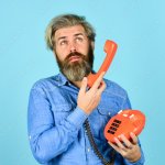 Man holding telephone