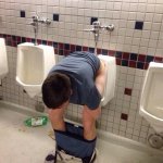 Man Sitting On Urinal