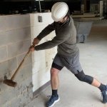 Politician Smashing Wall