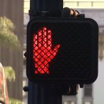 crosswalk sign red hand