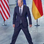 Olaf Scholz spreads his legs