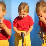 crying kid with gun