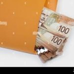 Envelope full of Canadian Cash