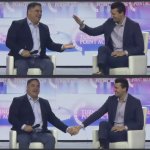 Cenk Uygur & Charlie Kirk at America Fest 2024 holding hands