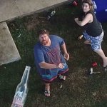 People throwing bottles at drone