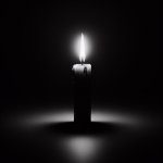 Flickering candle on black background