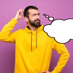 puzzled man in yellow hoodie