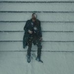 Ryan Gosling laying in snow