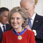 Hillary Clinton receives medal from Joe Bidebn