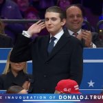 Barron Trump with hand to ear