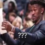 Jimmy butler looking at paper