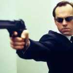 Agent Smith aims gun