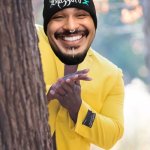 Guy hiding behind tree