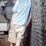 Brad Delson against a fence