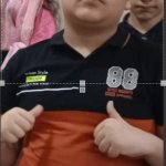 Fat kid doing thumb up.