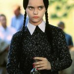 Wednesday Adams with a bottle of poison