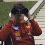 Charles Leclerc looking through binoculars
