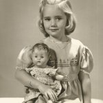 Little girl with doll