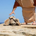 GRABS STONES WHTH RELIGIOUS INTENT